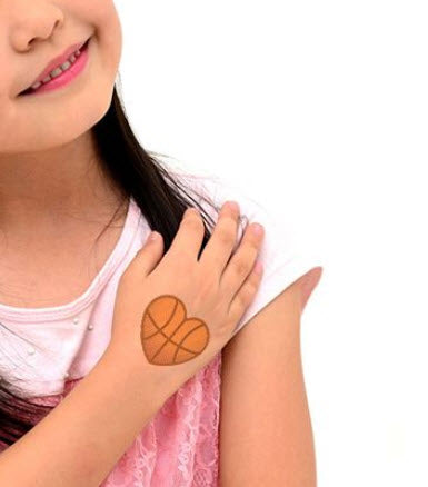 Fine line basketball tattoo on the forearm.