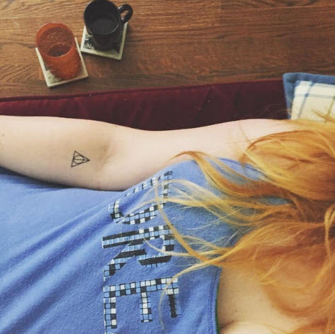Harry Potter Tattoos — the deathly hallows symbol on my outer right...