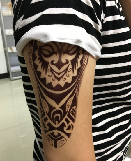 Leg and calf swirl maori tattoo for men