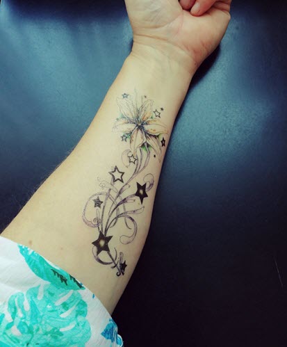 Premium Photo | Tattoos of a star with a flower and a starfish on it  generative ai
