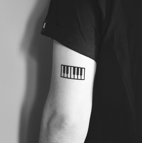 piano keys tattoo back