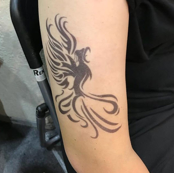 Phoenix tattoo a symbol of rebirth and renewal Vector Image